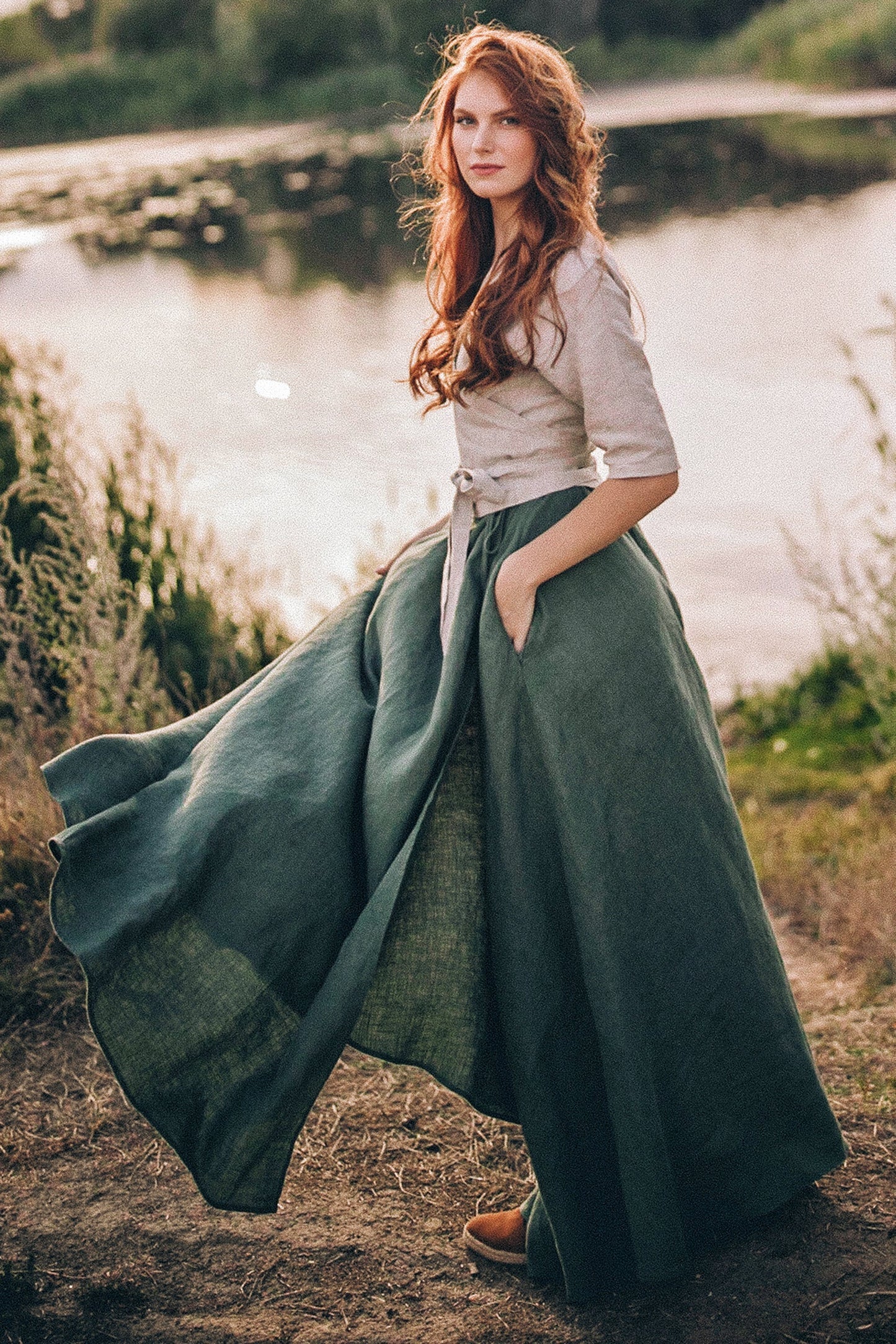 Woman wearing heavyweight linen maxi skirt with tie wrap closure by the lake