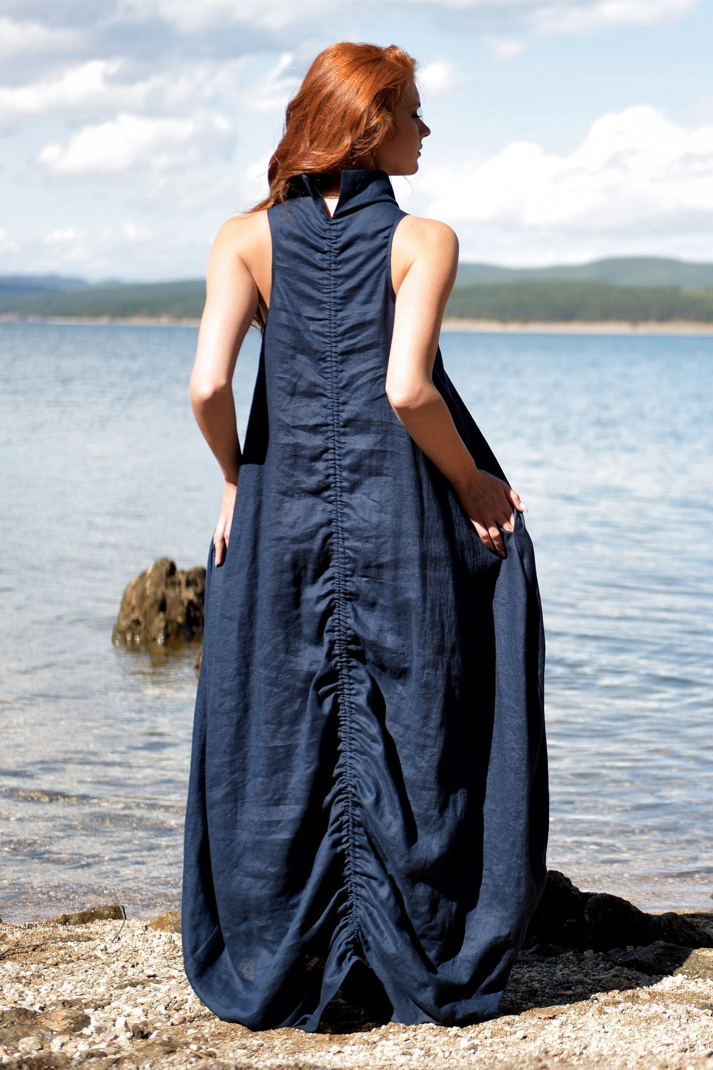 Night blue cowl neck linen dress with ruched back and side pockets by the water