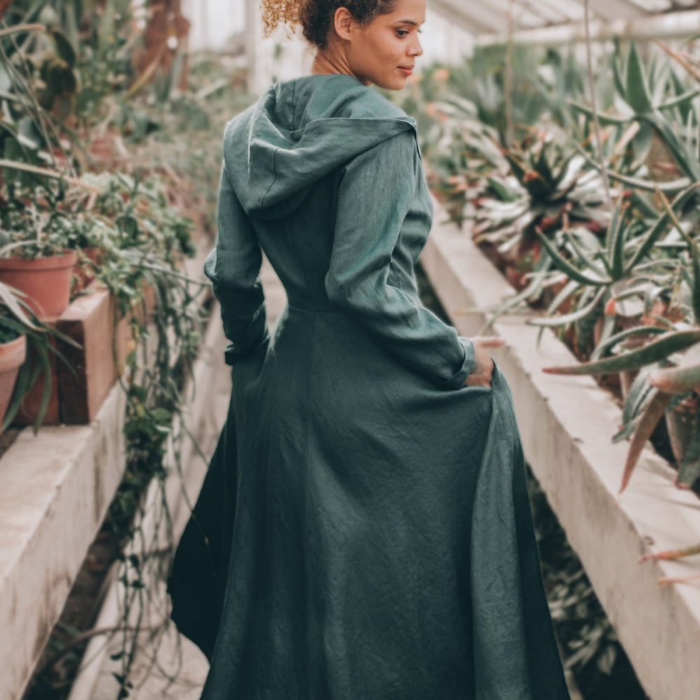 Elegant summer linen coat with a hood and tie closure, perfect for chilly evenings.