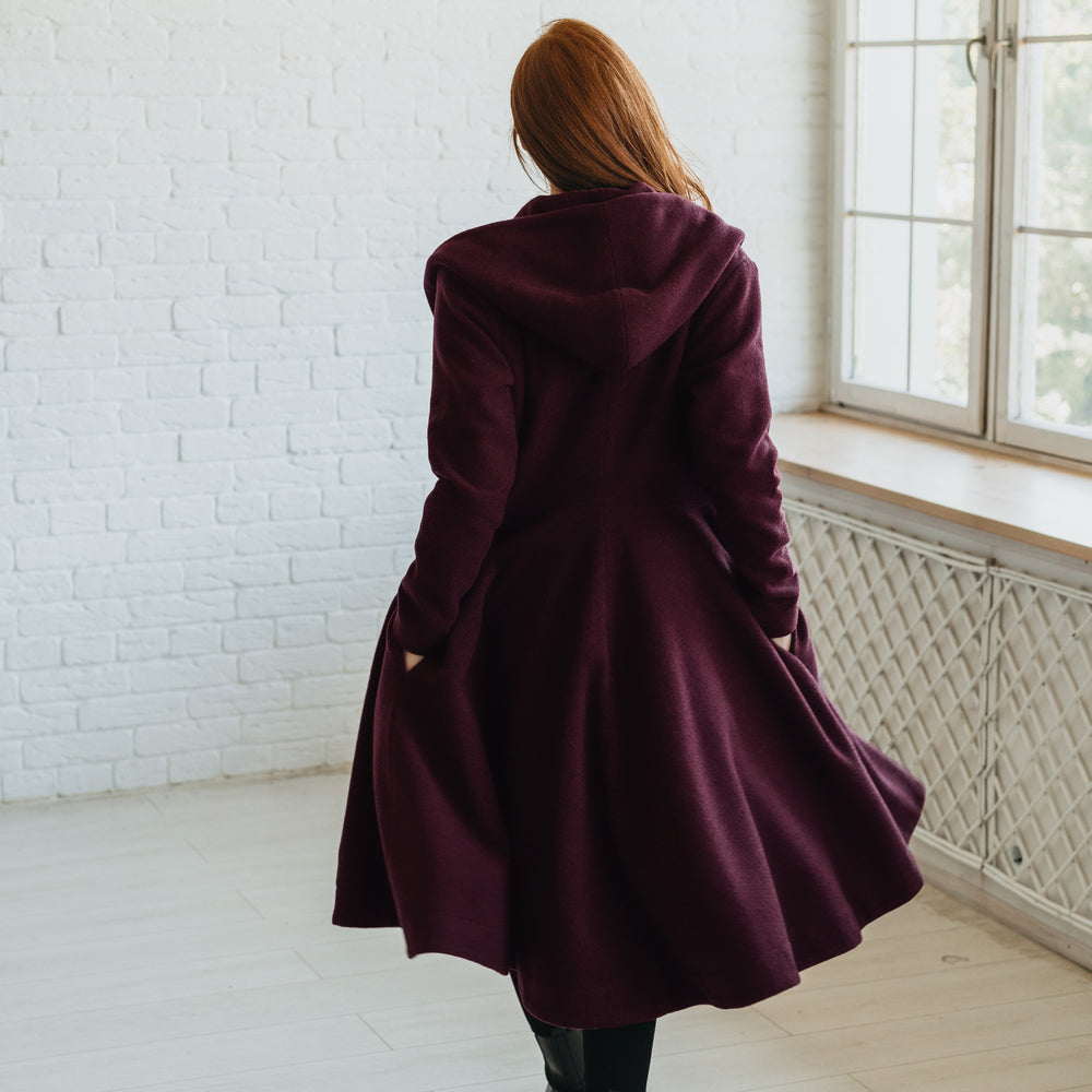 
                      
                        Merino Wool Flared Coat in Midi Length
                      
                    