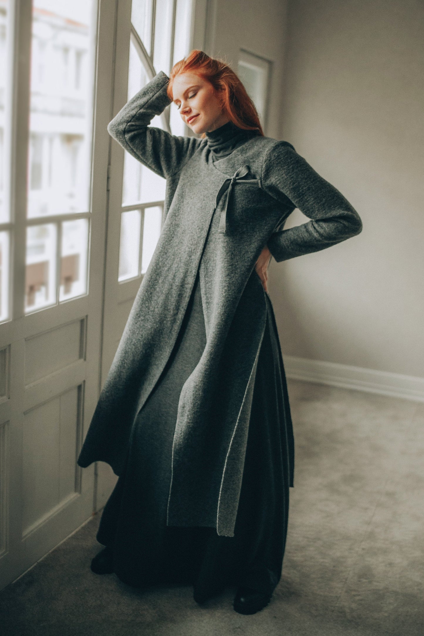 Long gray wool cardigan with side slits and tie closure for a modern, cozy fit