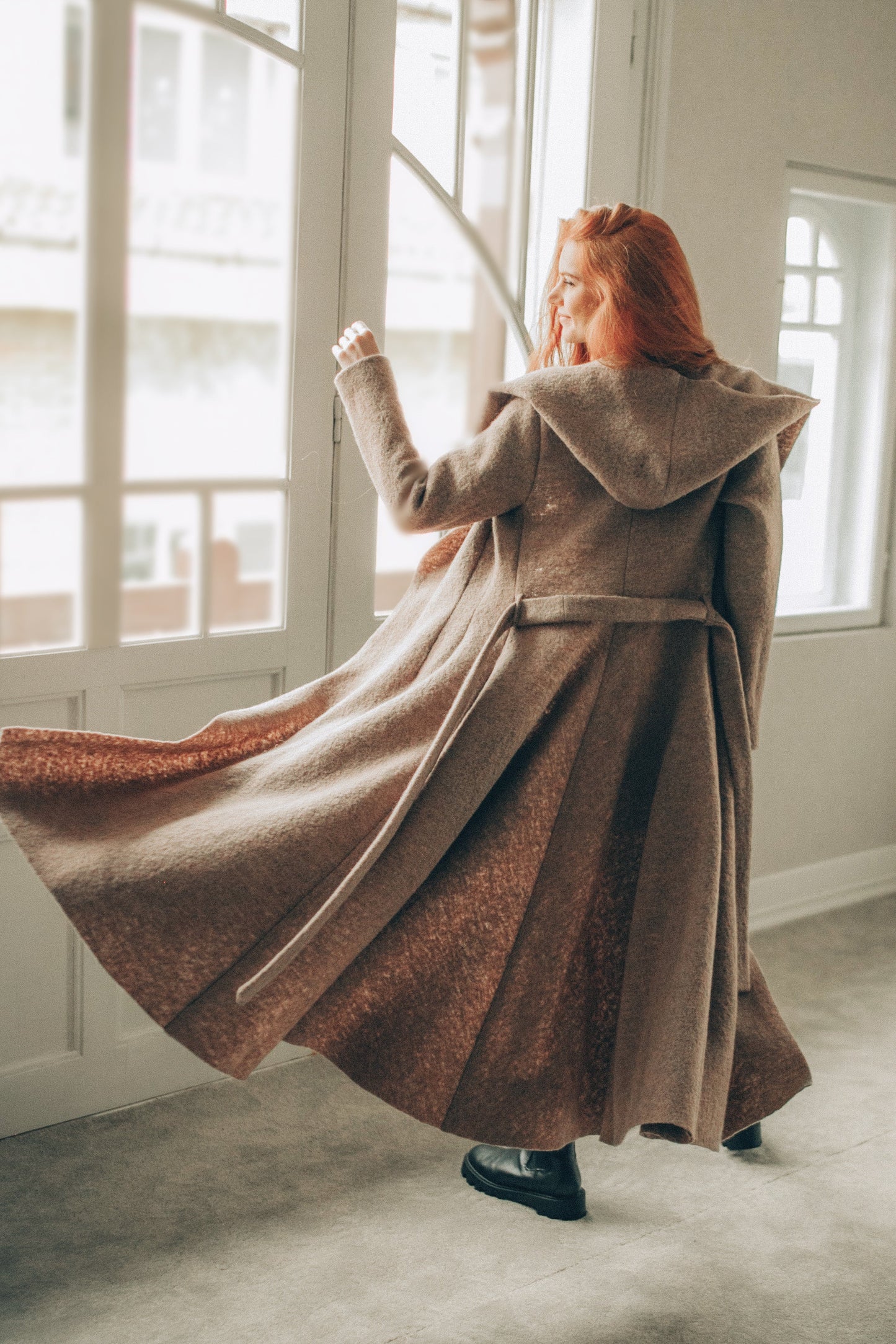 Maxi wool hooded cardigan coat in princess silhouette with adjustable belt and flowing skirt