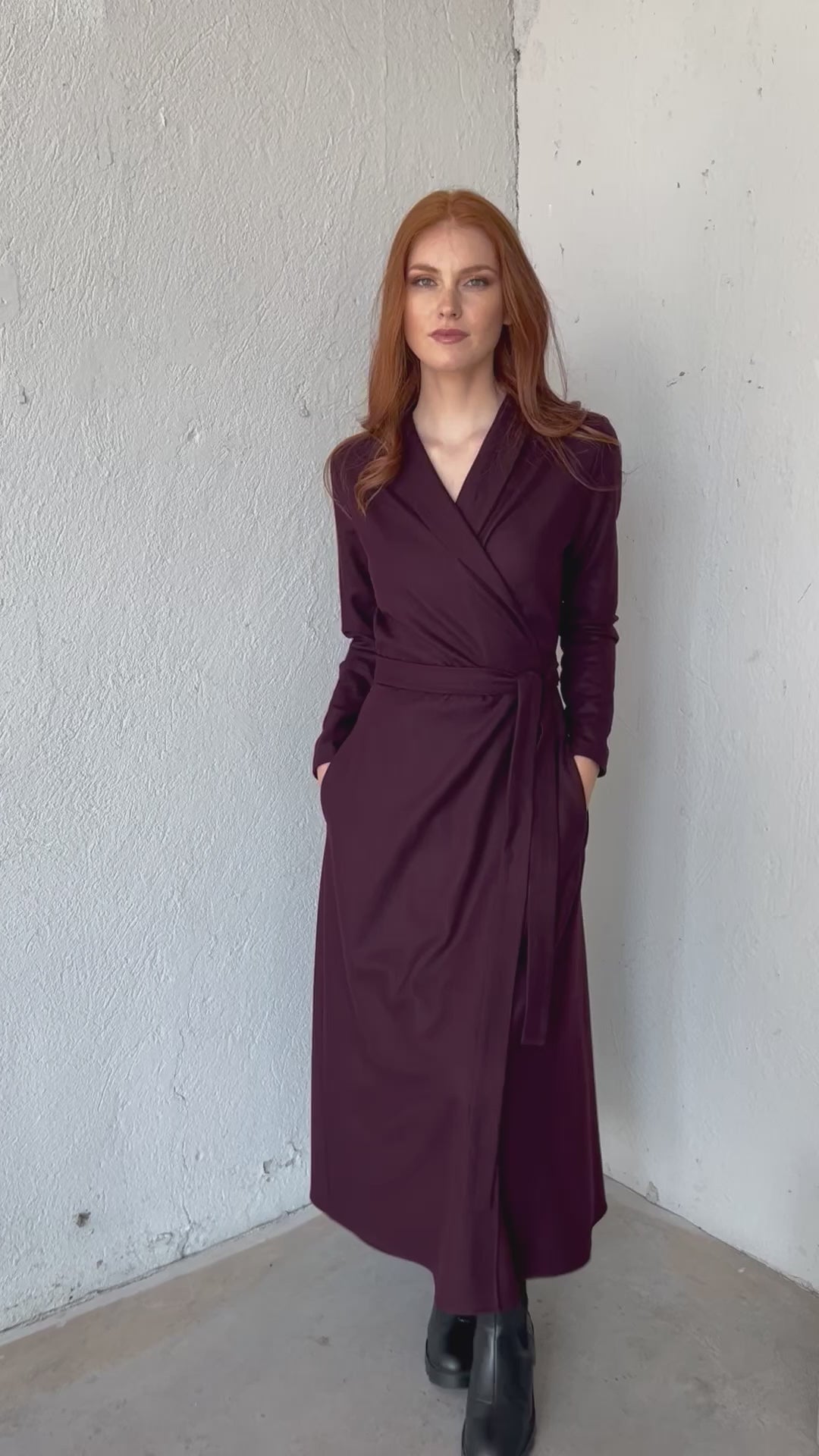 Video of a midi wool wrap dress with a shawl collar and side pockets, showing the fit, silhouette, and movement of the design.