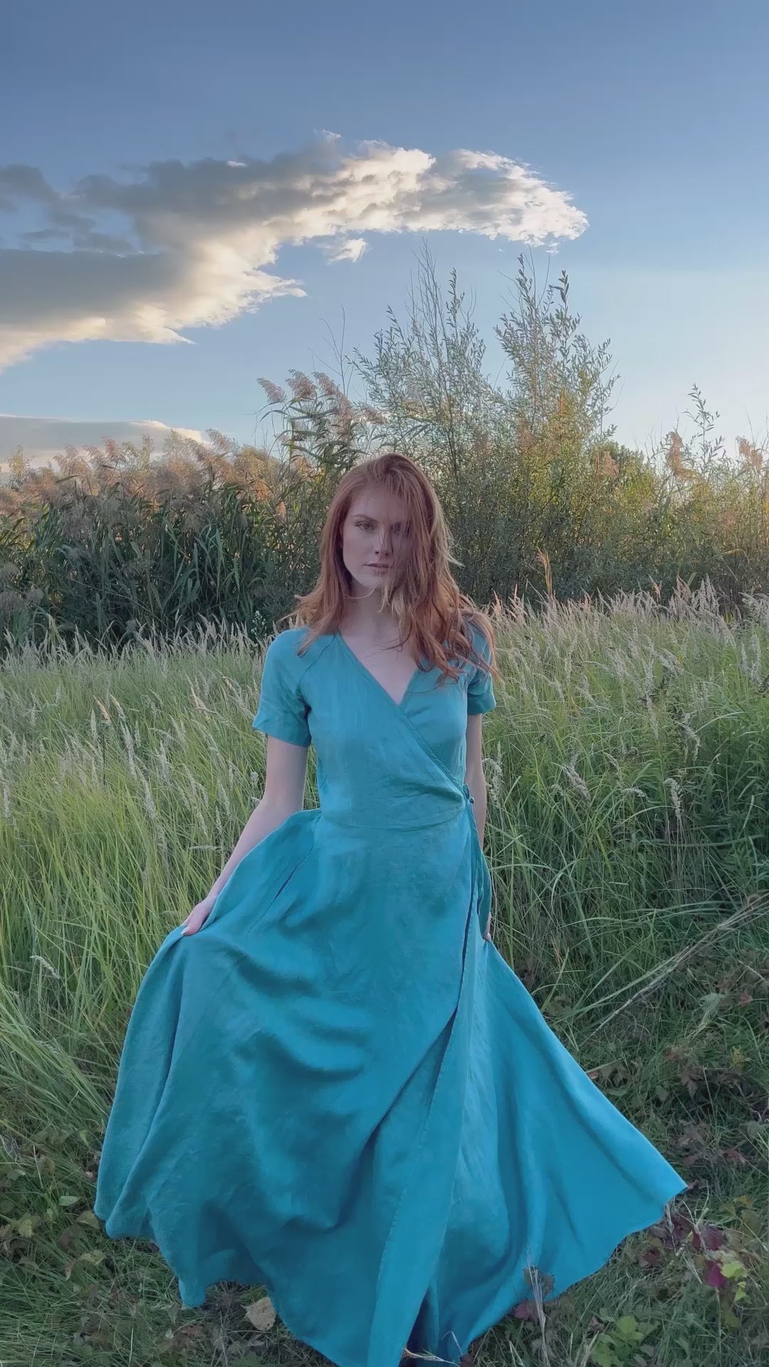 Model wearing the Maxi Linen Gown with Wrap Belt, showing the tied waist, flowing linen drape, and full-length fit in motion