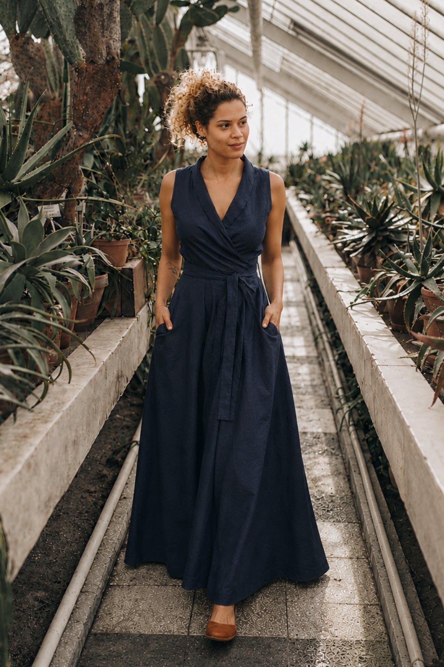 Sleeveless linen maxi dress with wrap design and tie waist in classic color