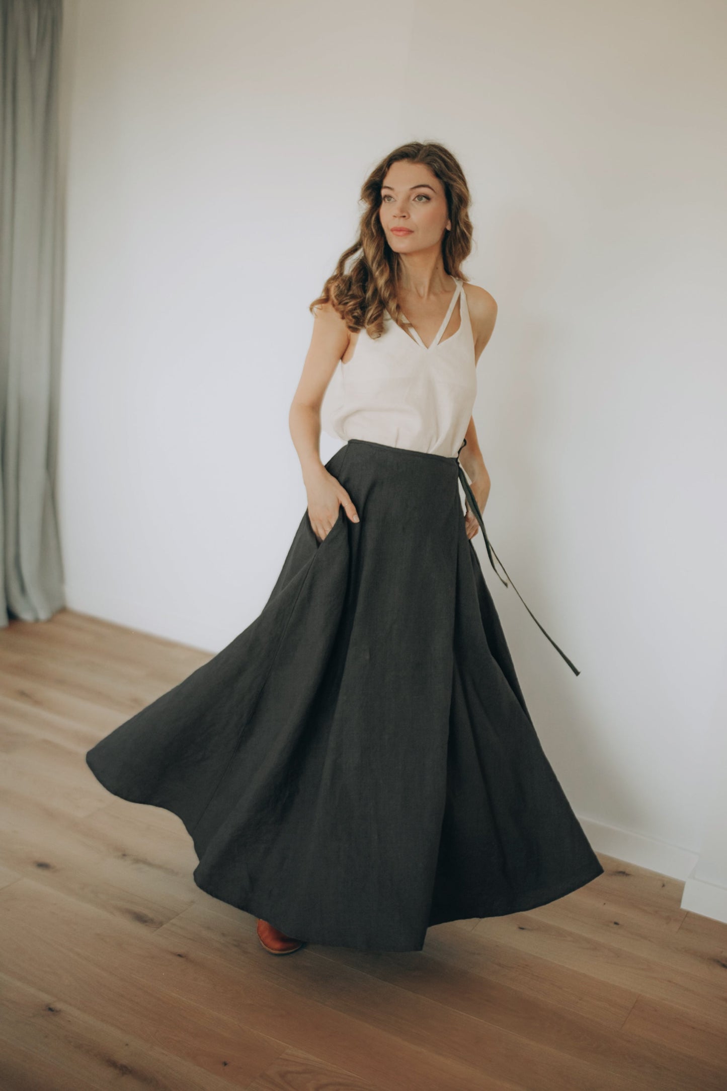 Heavyweight linen wrap skirt ankle length with side pockets on model