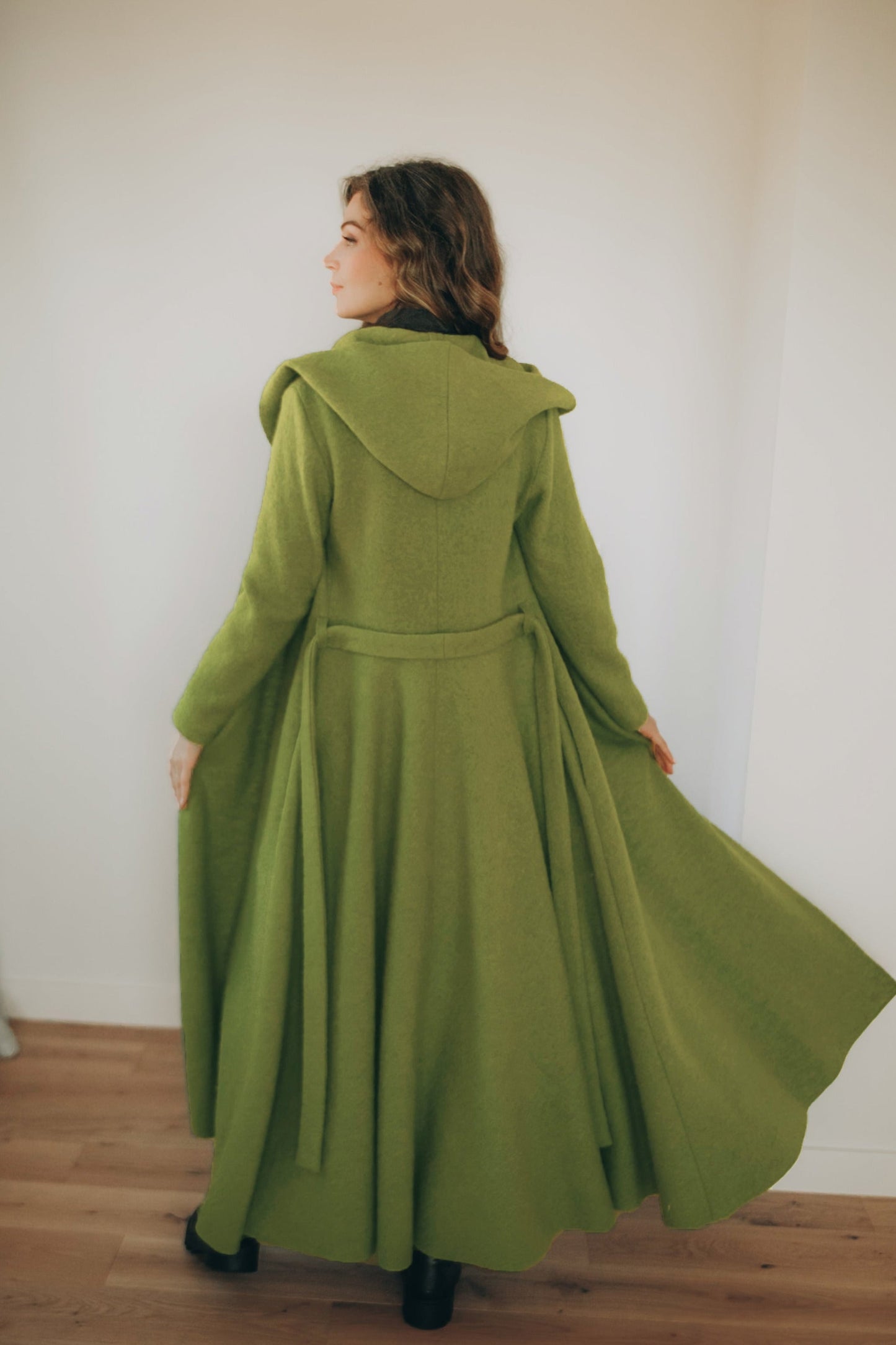 Maxi wool hooded cardigan coat with princess silhouette and adjustable belt worn by model